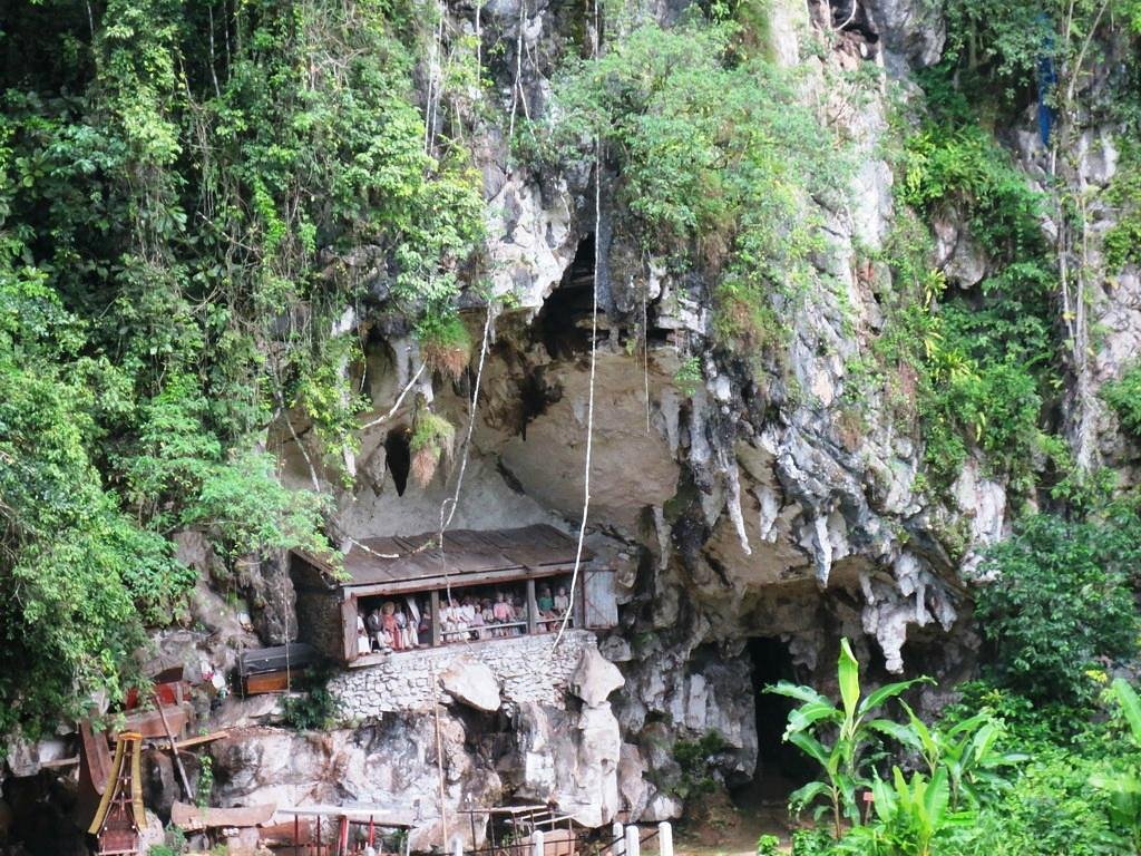 Londa cliffside burial cave with wooden effigies in Toraja